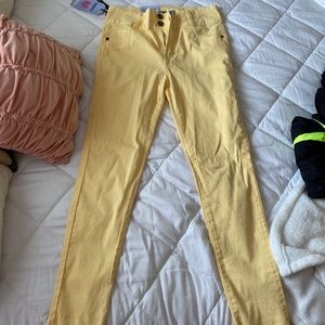 Pastel yellow skinny jeans